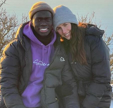 Awer Mabil with his partner Camilla Duelund.